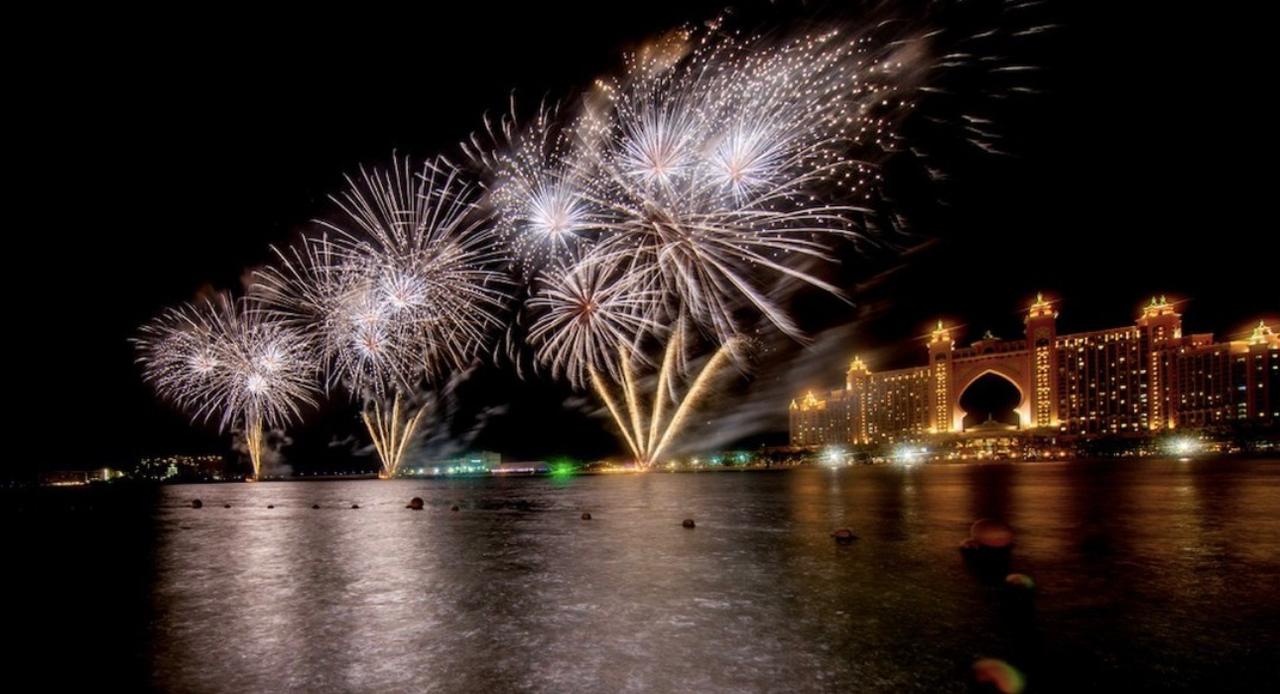 Fireworks over the water at a landmark waterfront celebration